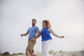 Happy couple running to beach Royalty Free Stock Photo