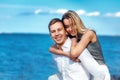 Happy couple on sea background. happy young romantic couple in love have fun on l beach at beautiful summer day Royalty Free Stock Photo