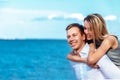 Happy couple on sea background. happy young romantic couple in love have fun on l beach at beautiful summer day Royalty Free Stock Photo