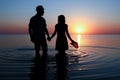 A Happy couple by the sea at sunset on travel silhouette in nature