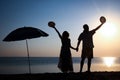 A Happy couple by the sea at sunset on travel silhouette in nature Royalty Free Stock Photo