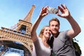 Happy couple selfie in Paris