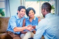 Happy couple shaking hands with real estate agent Royalty Free Stock Photo