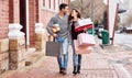 Happy couple, shopping bags and walking in city with gifts for fashion, clothing or buying outdoors. Man and woman in Royalty Free Stock Photo