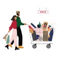 Happy couple are with shopping cart full of purchases. Cute man is carrying cart, smiling woman holding bags. Sale concept. Royalty Free Stock Photo
