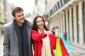 Happy couple shopping in an old town street Royalty Free Stock Photo