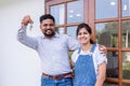 Happy couple showing keys for their new home, Happy house moving. Royalty Free Stock Photo