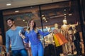 Happy couple showing their new credit card at the mall Royalty Free Stock Photo