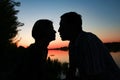 happy couple silhouette against a sunset romance Royalty Free Stock Photo