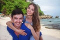 Happy Couple, Sitting At Beach, Holds Hands Royalty Free Stock Photo