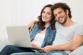 Happy Couple Sitting On Couch Royalty Free Stock Photo