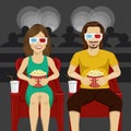 Happy couple sitting in movie theater watching 3D movie, eating popcorn, smiling. Royalty Free Stock Photo