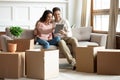 Couple using tablet buy goods online relocated at new home Royalty Free Stock Photo