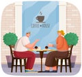 Happy couple sitting near cafeteria. Smiling man and woman drinking coffee with muffins together Royalty Free Stock Photo