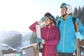 Happy couple with ski equipment spending winter vacation Royalty Free Stock Photo