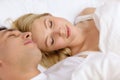 Happy couple sleeping in bed Royalty Free Stock Photo