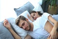 Happy couple sleeping in a comfortable bed at home. Royalty Free Stock Photo