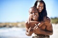 Happy couple, smile and piggyback with portrait, beach and married for summer vacation. African, enjoying and excited Royalty Free Stock Photo