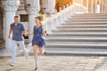 Happy couple smiling and running in Venice, Italy Royalty Free Stock Photo