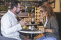 Happy couple smiling and talking in a burger pub restaurant - Married couple having lunch break at cafe bar - Lifestyle concept Royalty Free Stock Photo