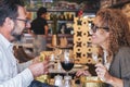 Happy couple smiling and talking in a burger pub restaurant - Married couple having lunch break at cafe bar - Lifestyle concept Royalty Free Stock Photo