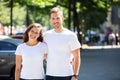 Happy Couple Standing On Street