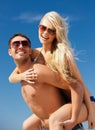 Happy couple in sunglasses on the beach Royalty Free Stock Photo