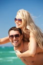 Happy couple in sunglasses on the beach Royalty Free Stock Photo