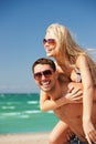 happy couple in sunglasses on the beach Royalty Free Stock Photo