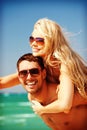 Happy couple in sunglasses on the beach Royalty Free Stock Photo