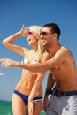 happy couple in sunglasses on the beach Royalty Free Stock Photo