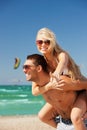 happy couple in sunglasses on the beach Royalty Free Stock Photo