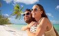 happy couple in sunglasses on exotic beach Royalty Free Stock Photo