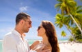 Happy couple in sunglasses over tropical beach Royalty Free Stock Photo