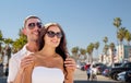 Happy couple in sunglasses over venice beach Royalty Free Stock Photo