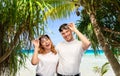 Happy couple in sunglasses on tropical beach Royalty Free Stock Photo
