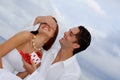 Happy couple with surprise gift Royalty Free Stock Photo