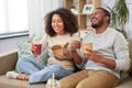 Happy couple with takeaway food and drinks at home Royalty Free Stock Photo