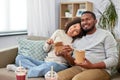 Happy couple with takeaway food and drinks at home Royalty Free Stock Photo