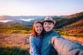 Happy couple takes selfie at beautiful Port Hills, Christchurch in New Zealand