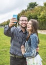 Happy Couple taking a selfie in a French Garden