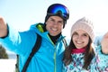 Couple taking selfie in mountains. Winter vacation Royalty Free Stock Photo