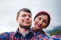 Happy couple taking selfie self-portrait photo hiking