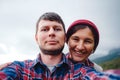 Happy couple taking selfie self-portrait photo hiking