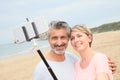 Happy couple taking selfie souvenir on holdays