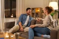 Happy couple talking at home in evening Royalty Free Stock Photo