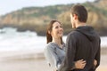 Happy couple of teens hugging and looking each other Royalty Free Stock Photo