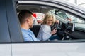 Happy couple in their new car. Royalty Free Stock Photo