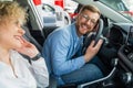 Happy couple in their new car. Royalty Free Stock Photo