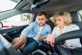 Happy couple in their new car. Royalty Free Stock Photo